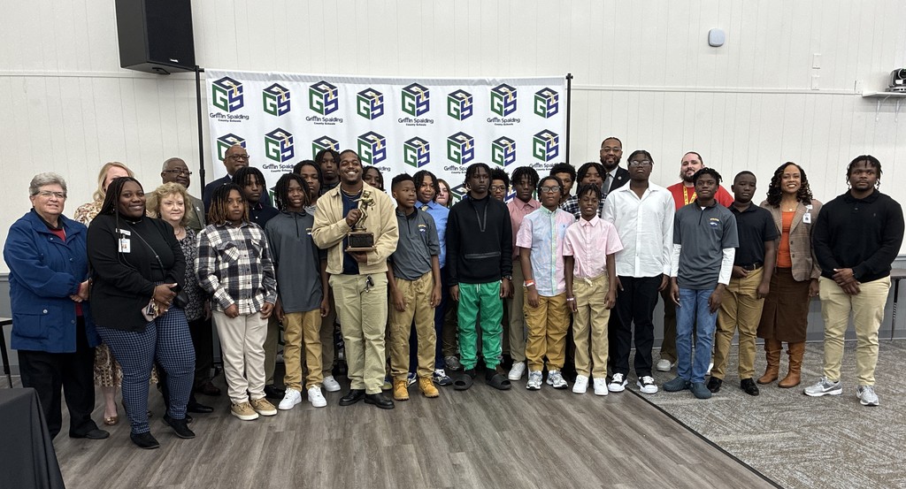 posing with certificate