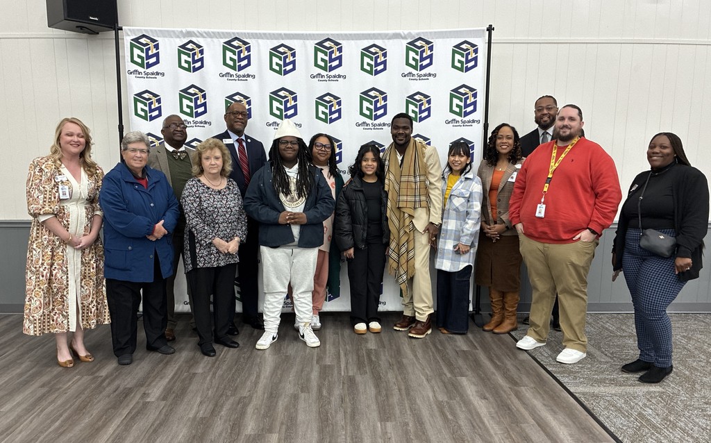 posing with certificate