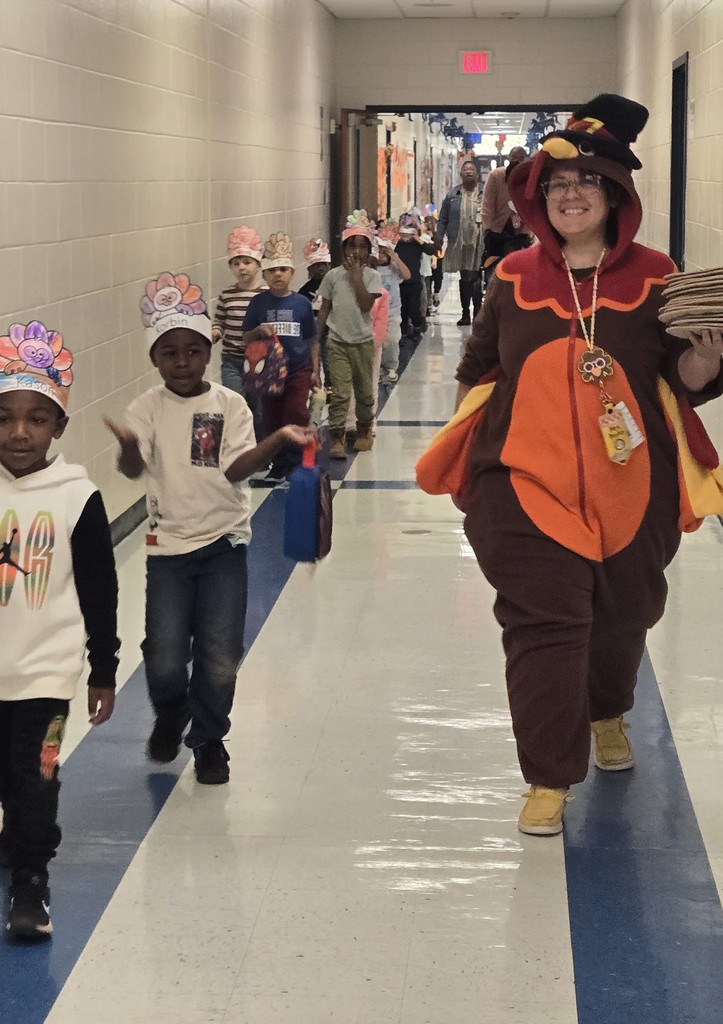 students and turkey teacher walking down the hall