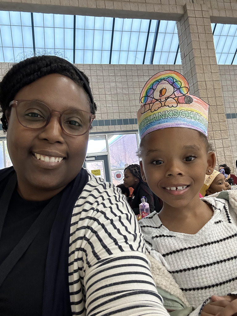 staff member with student at table