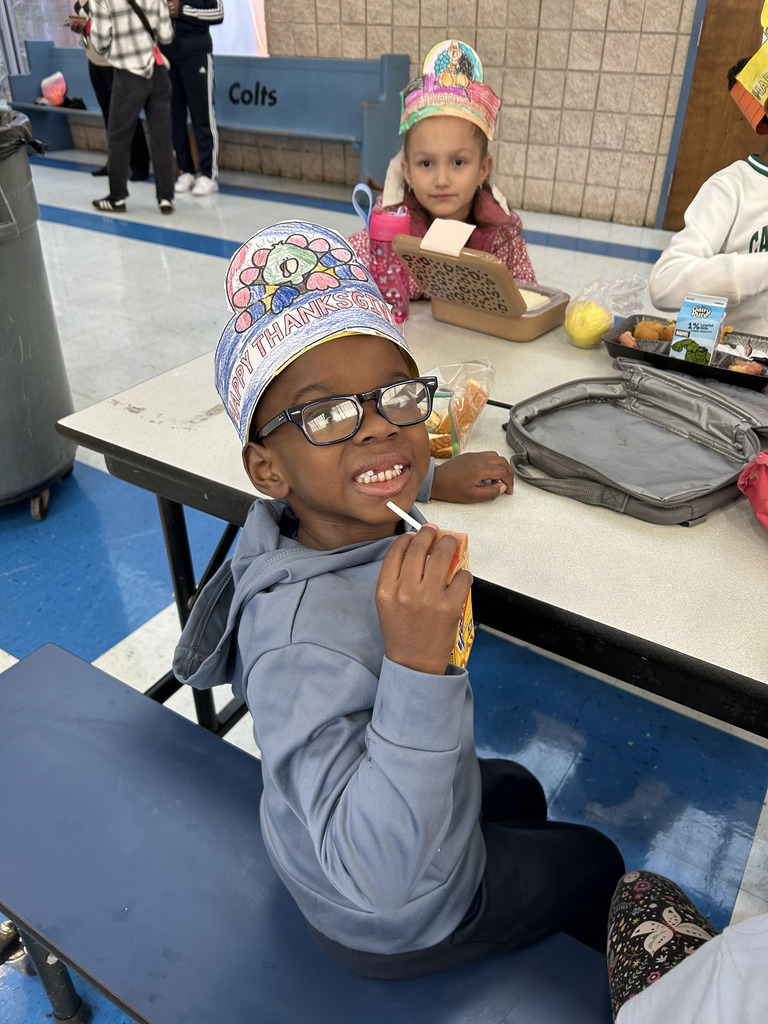 students at table eating