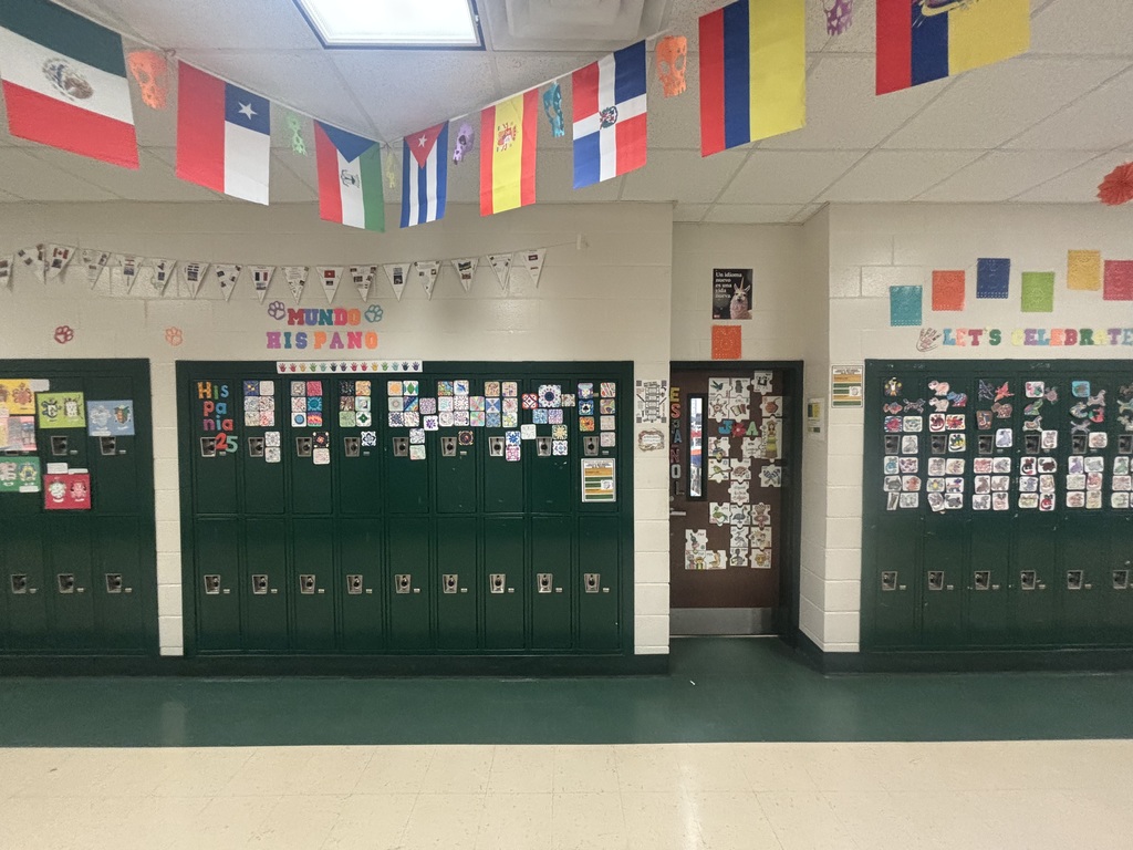 A colorful Hispanic heritage display on lockers and a classroom door