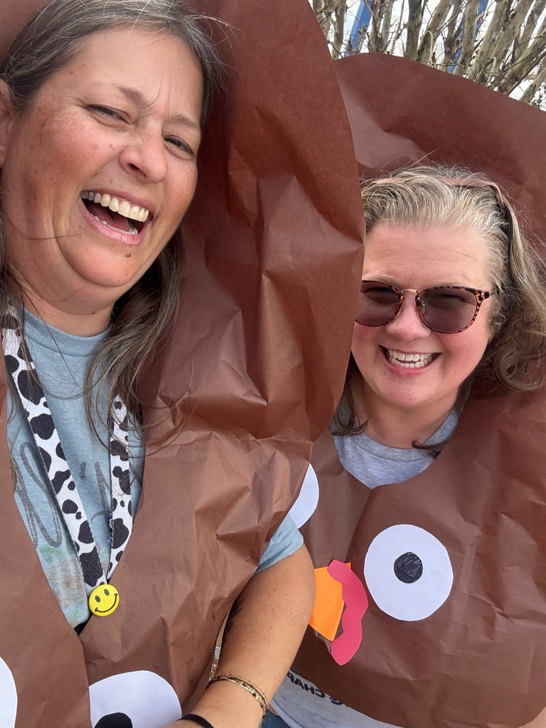 2 women in turkey outfits, laughing