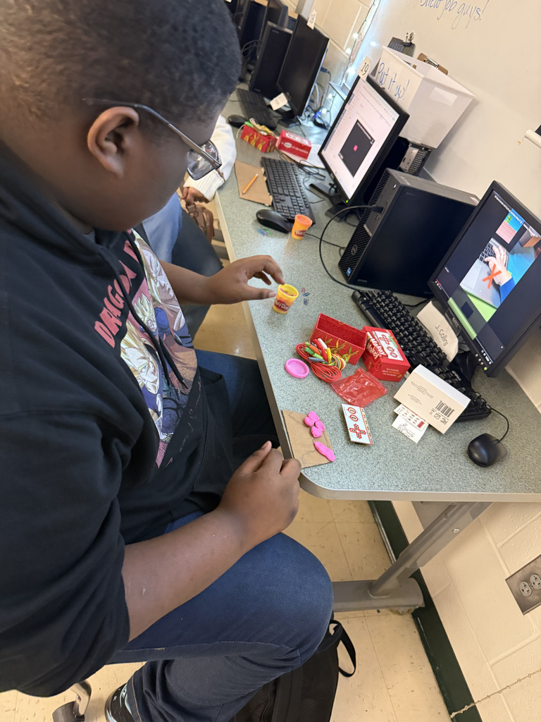 A student tests out his controller on a game