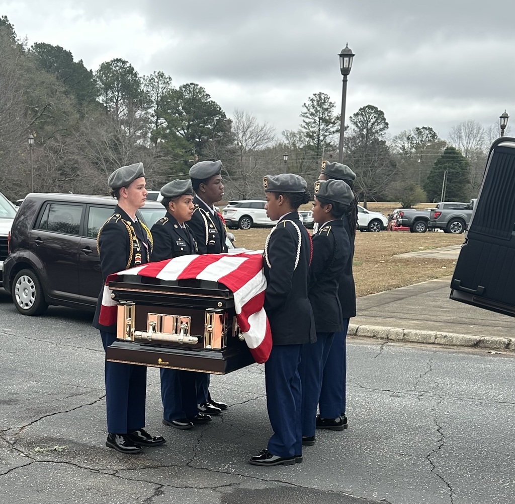Cadets hold flag-draped coffin