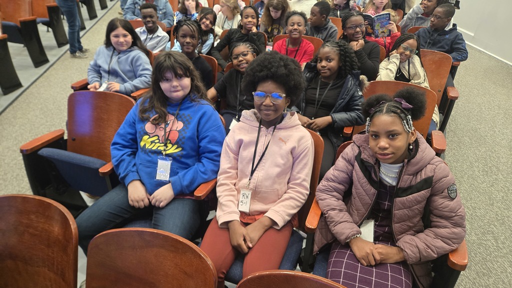 group of kids sitting in aud