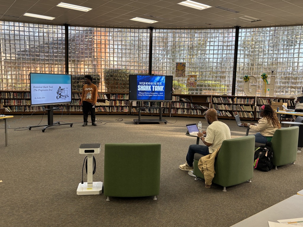 A student presents their pitch for historical shark tank