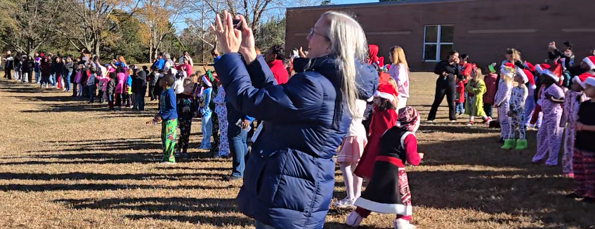 students on hill pointing