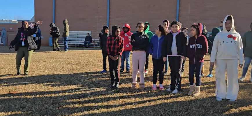 students on hill waiting