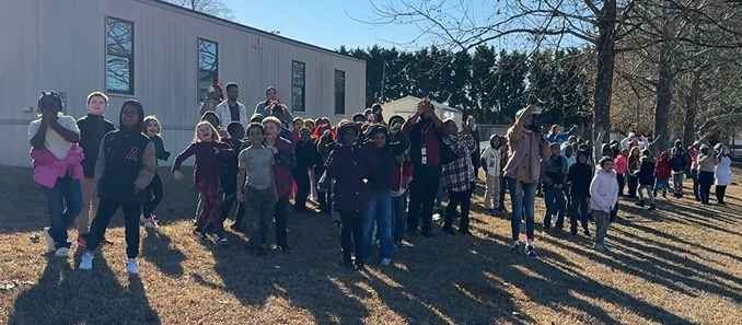 students on hill waiting