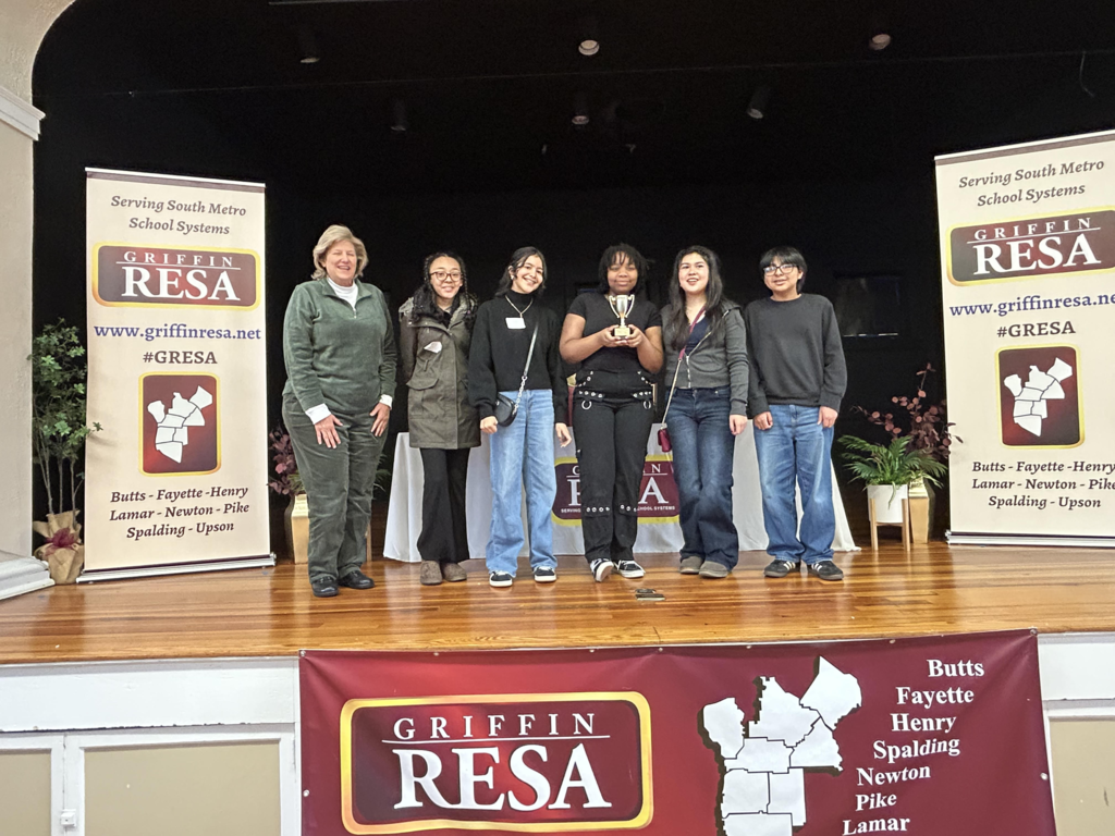 students with trophy