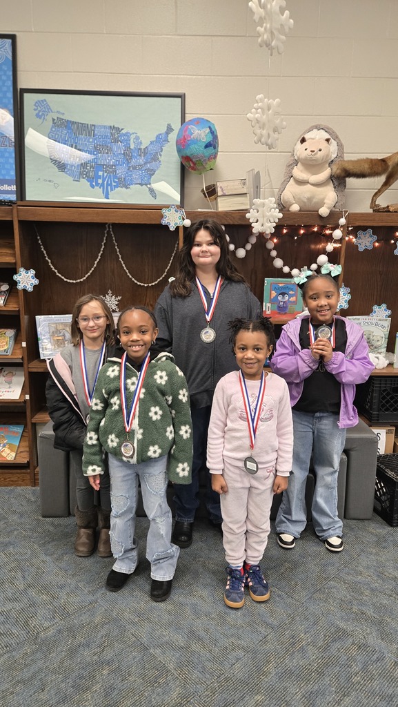 5 girls wearing medals