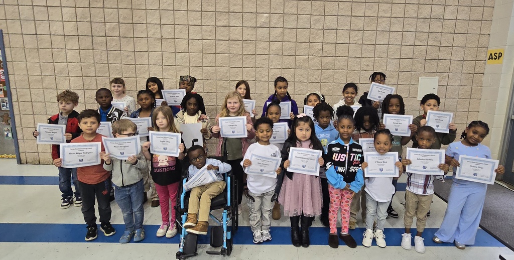 group of kids in lines holding certificate