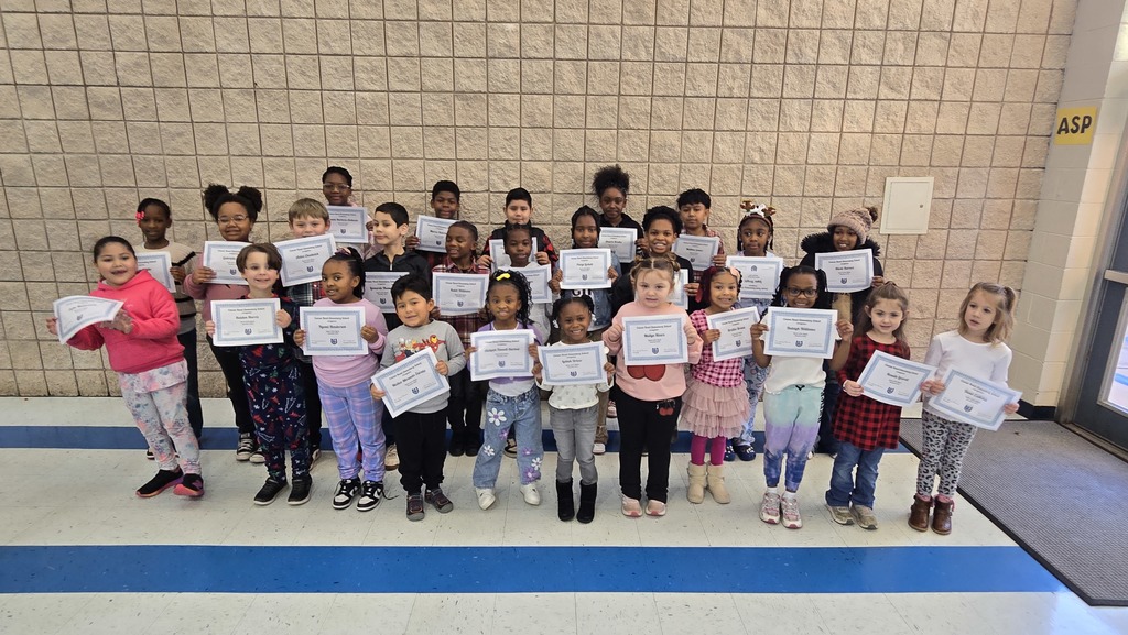 group of kids in lines holding certificate