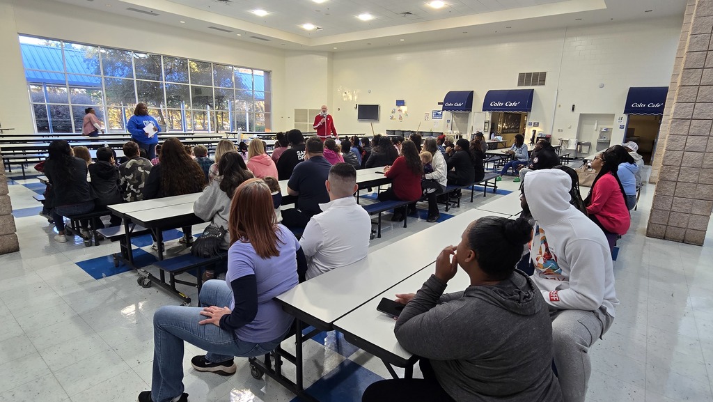 parents at tables in cafeteria