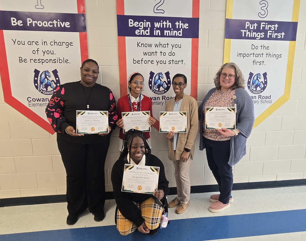 staff with certificates in hall