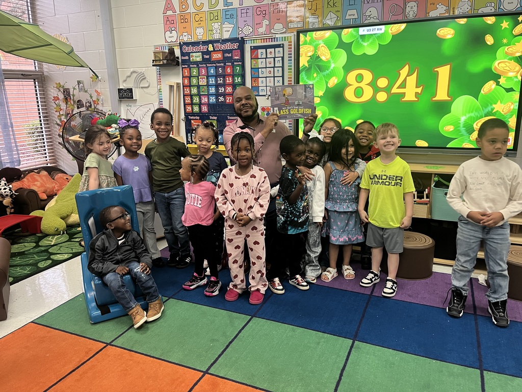 man reading to class of students