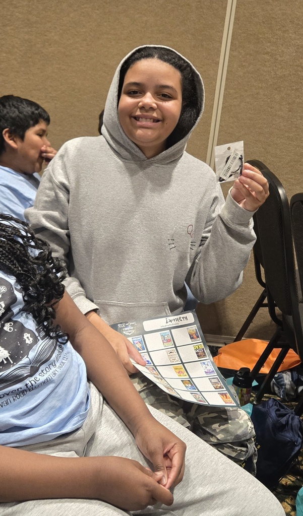 Girl holding up bracelet