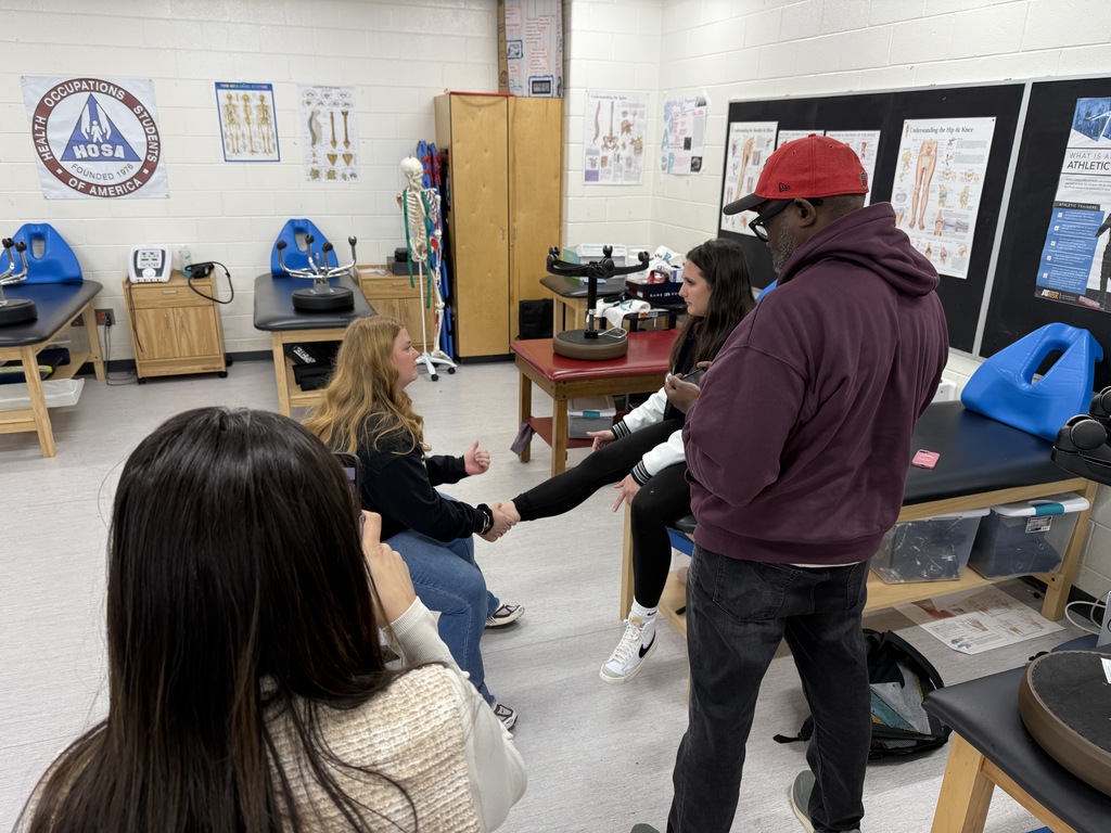 trainer working on sprained ankle