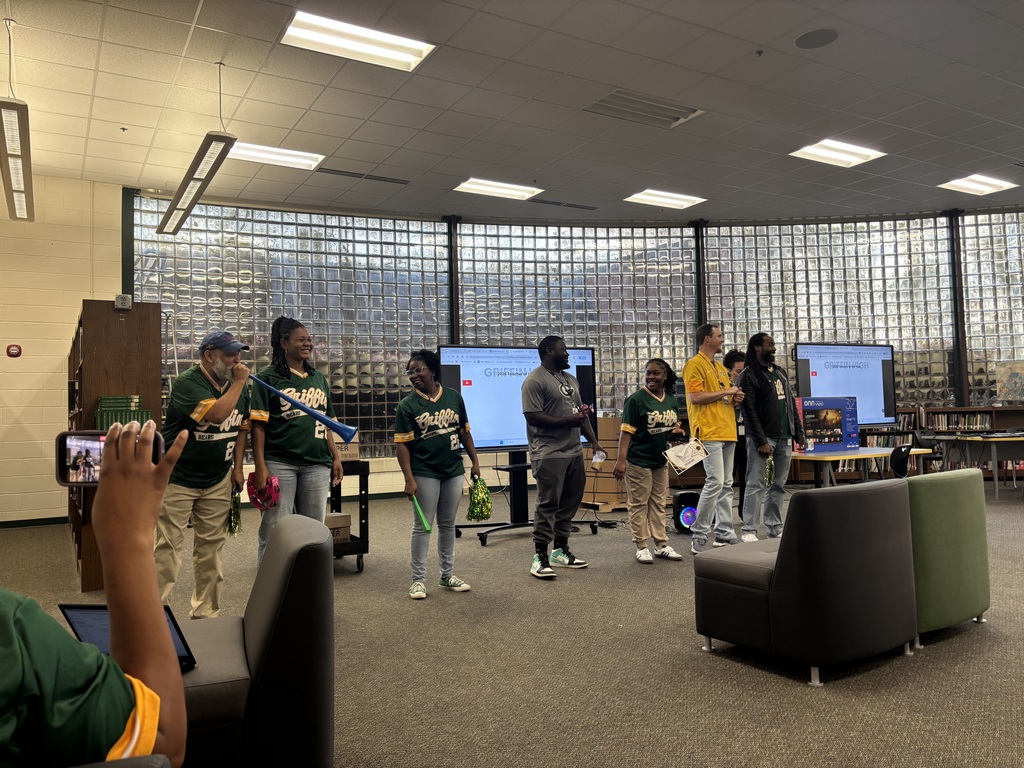 The teacher of the year finalists cheer as the winner is announced