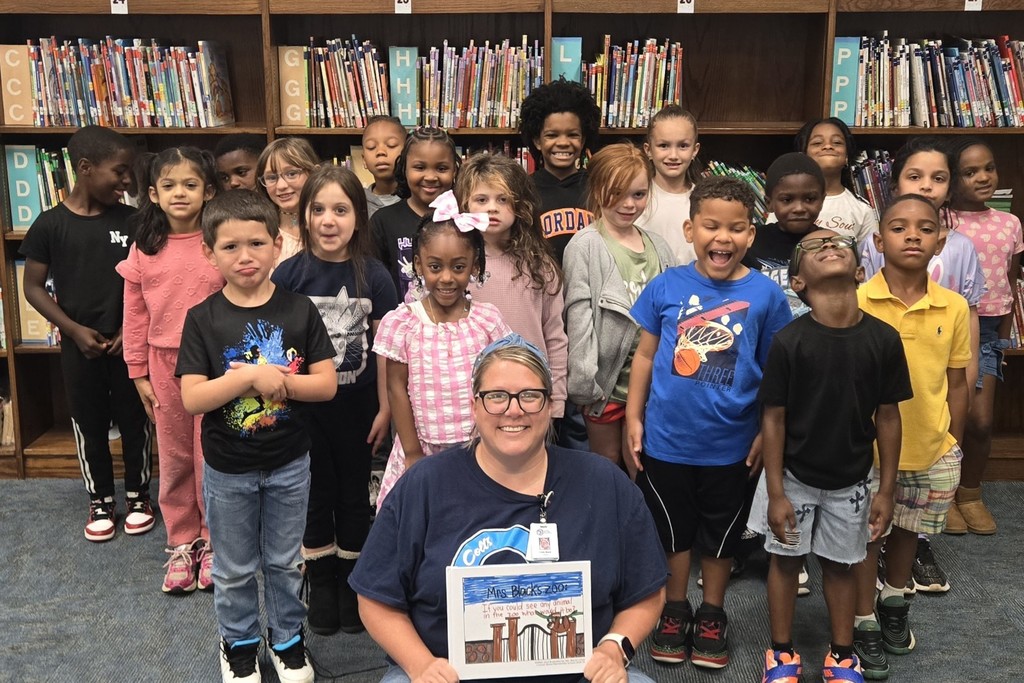 class pic holding book