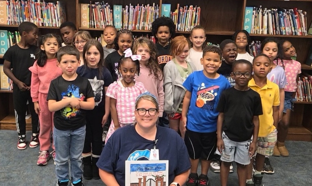 class pic holding book