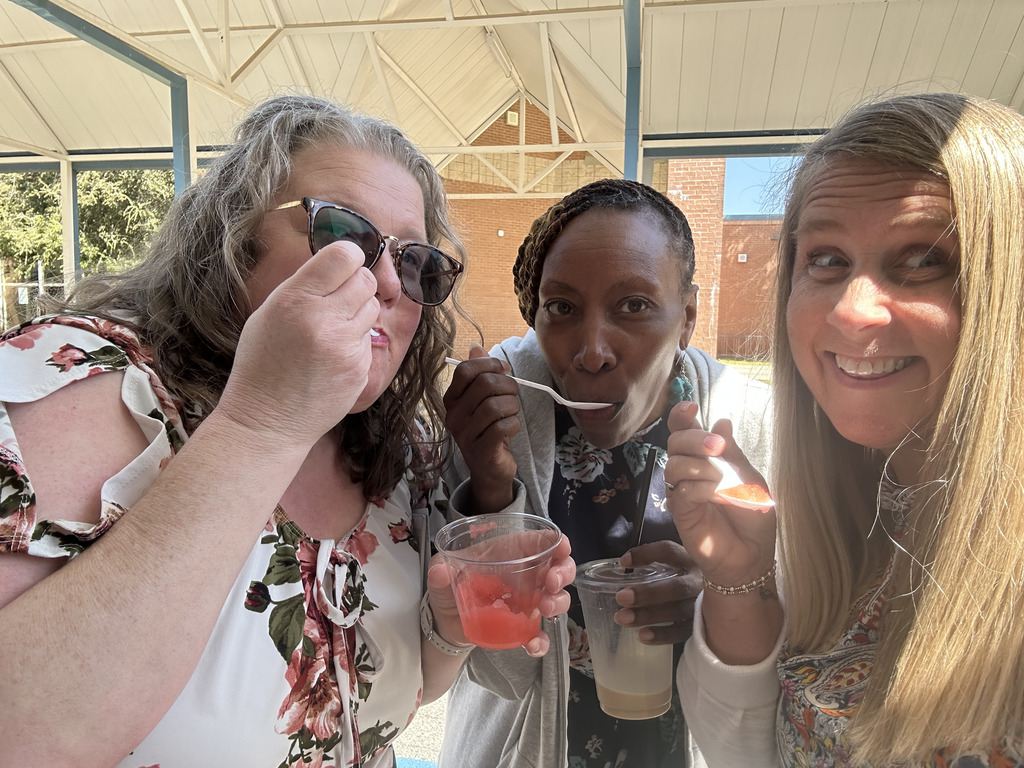 three women in front of coffee truck