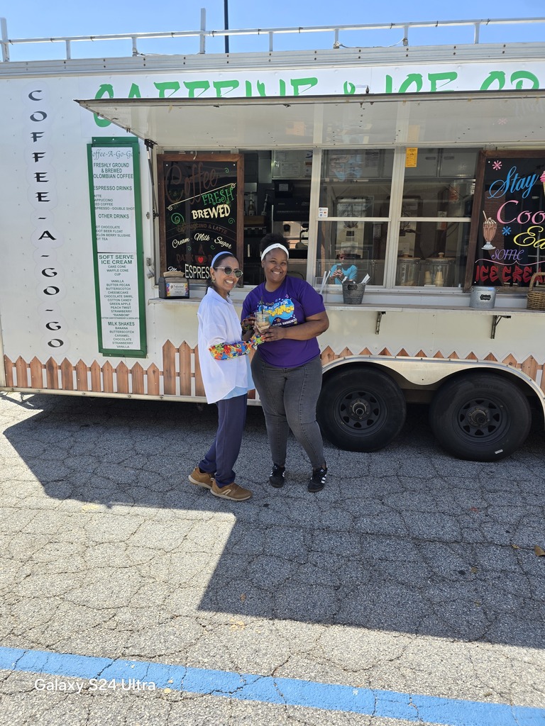 two women in front of coffee truck