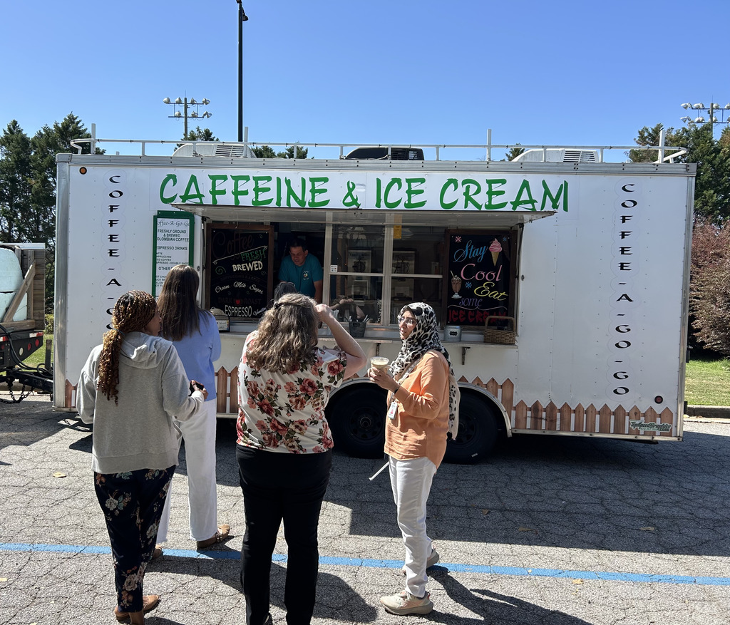 several people in front of coffee truck, placing orders