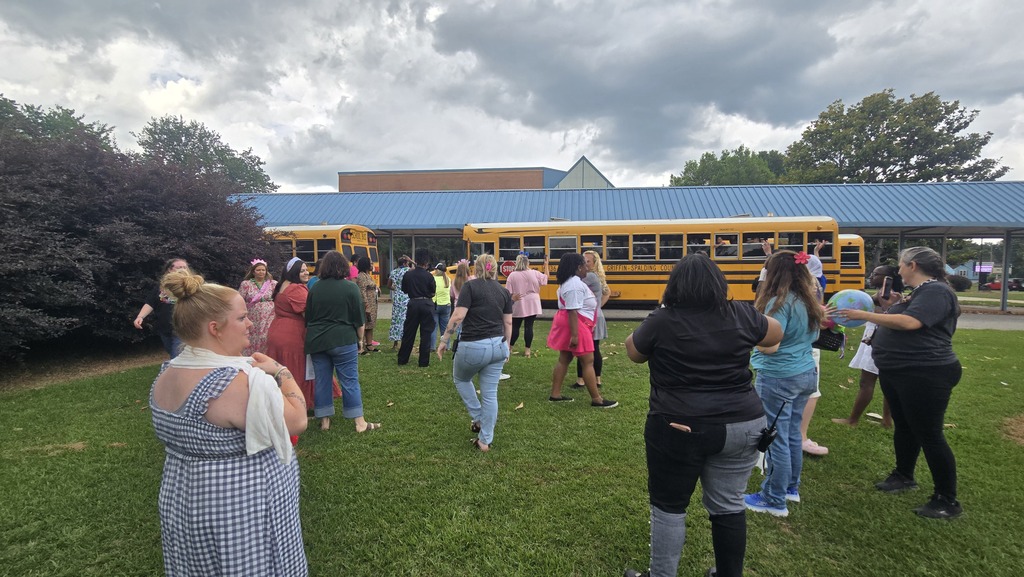 teachers waving to students