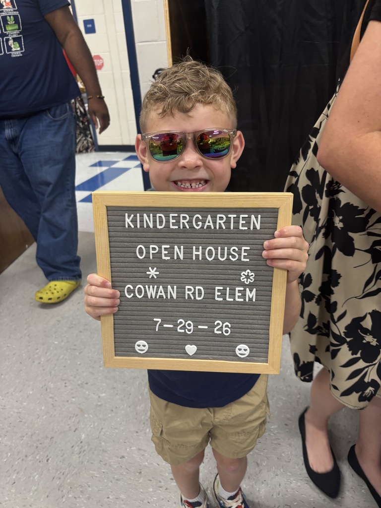 little boy with "Kindergarten Open House" letterboard