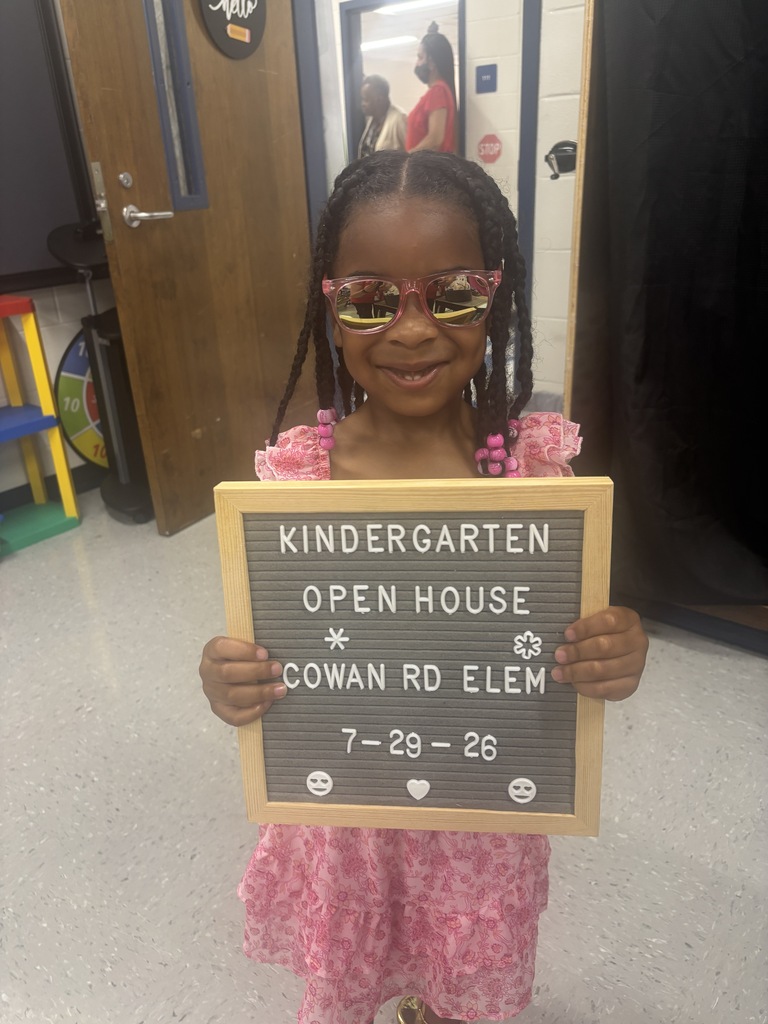 little girl with "Kindergarten Open House" letterboard