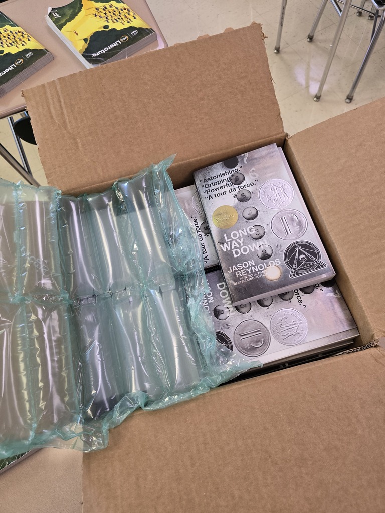 A newly opened box of books