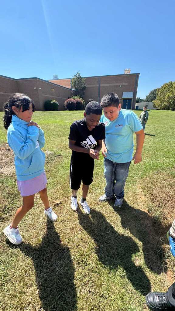 students looking at flowers