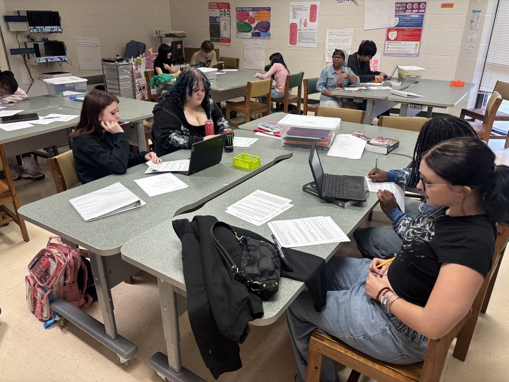 Students work in stations on sensory perception in AP Psychology