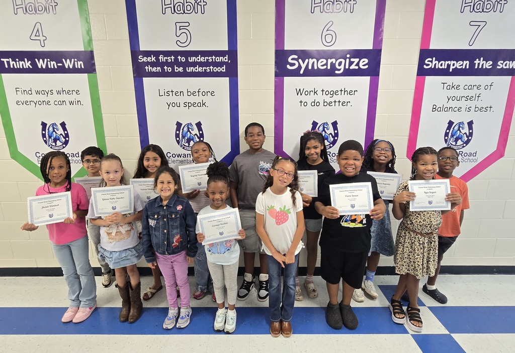 students holding certificates