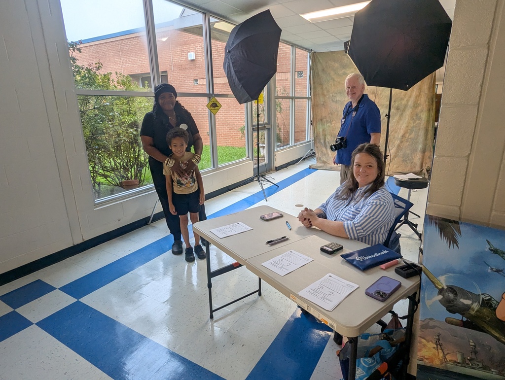 photographer and assistant with student and adult