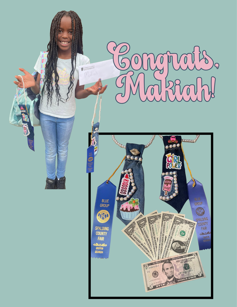 A graphic congratulates Makiah  on earning first place for her 4-H artwork. The image shows Makiah, a smiling elementary-aged student, holding a blue first-place ribbon and her artwork. A second image displays her decorated denim artwork along with her first-place ribbons and prize money. The graphic has a light teal background and the words “Congrats, Makiah!” in large pink lettering.