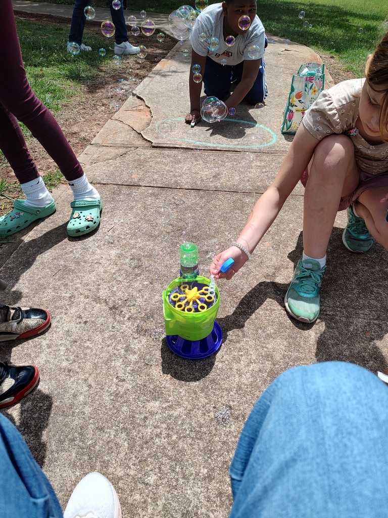 students with chalk and bubbles