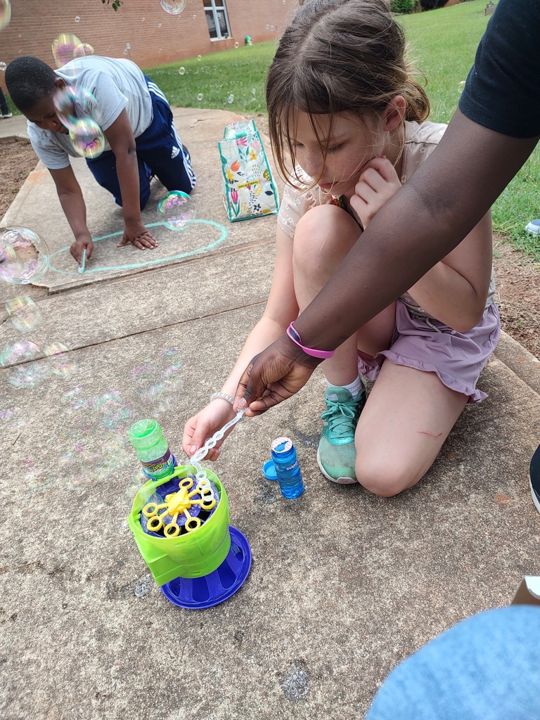 students with chalk and bubbles