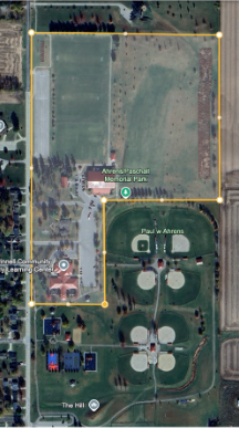 Aerial image of Ahrens Park with yellow outline of git to school district