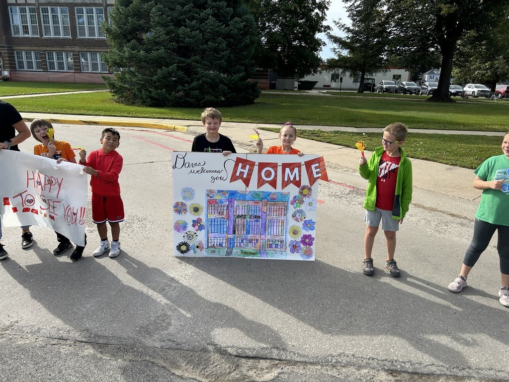 Students holding sign for parade