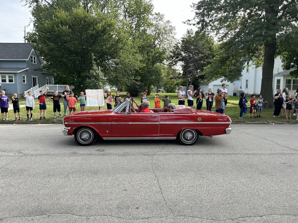 Mrs. Edith Renfrow Smith in red convertible