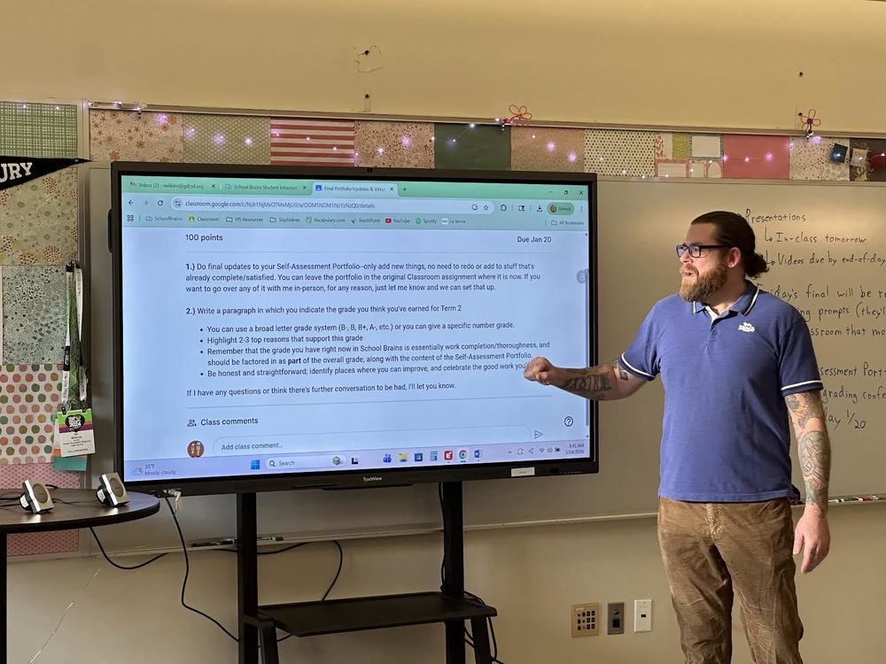 Mr. Wilkins works at the new interactive panel.