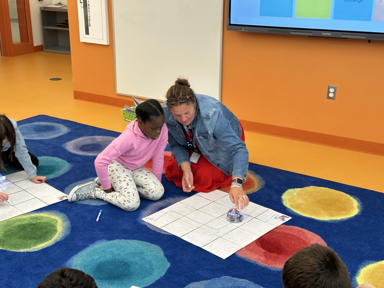 Mrs Kelley works with a student