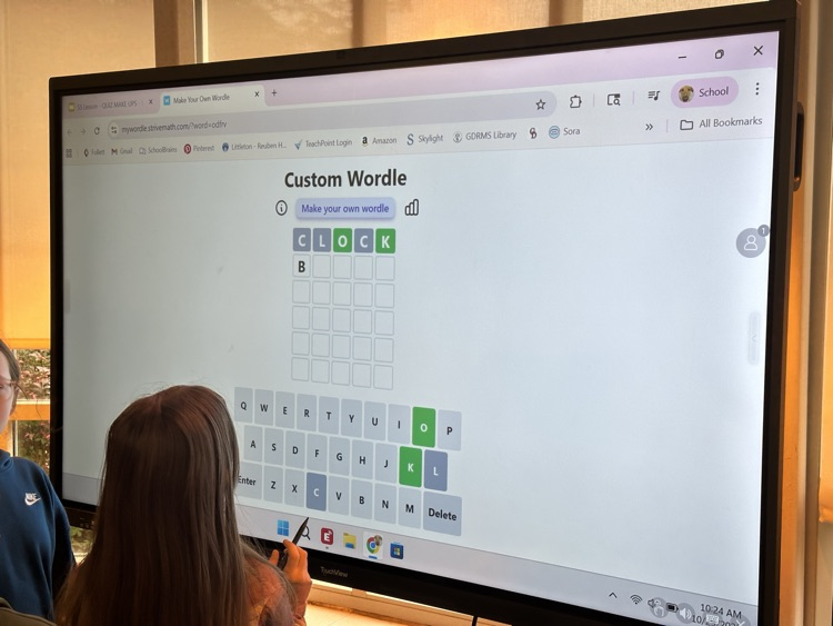 students working together on a interactive panel