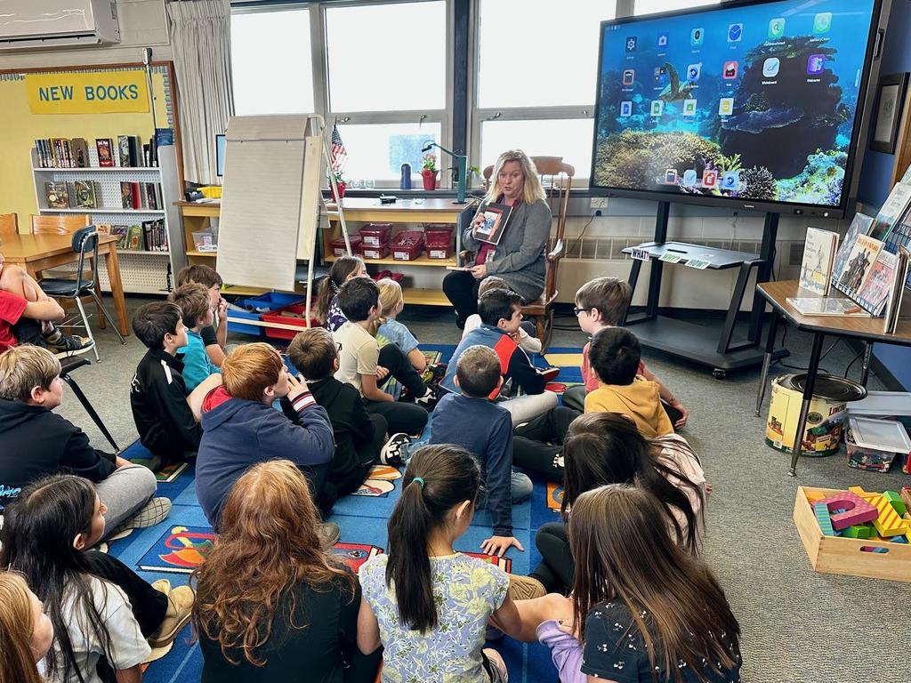 Mrs. Long reading to students