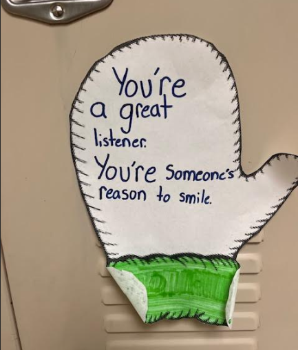 A paper mitten that says "You're a great listener. You're someone's reason to smile."