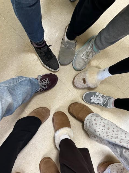 A photo showing nine shoes in a circle for "Comfy Feet Friday"