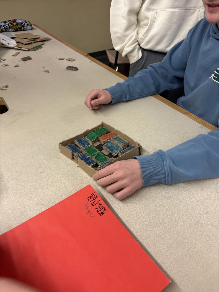 7th grade students testing a therapeutic toy.